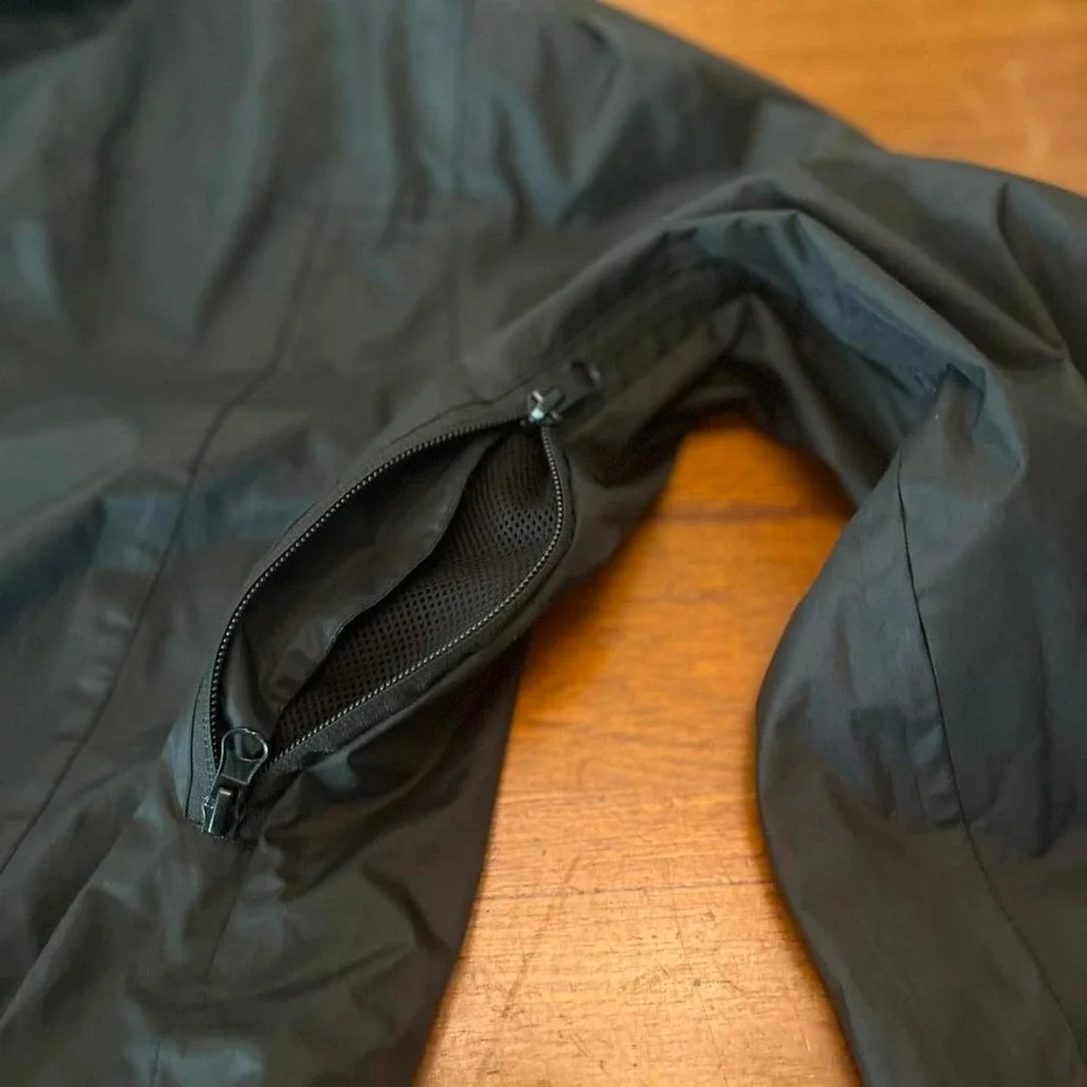 Black and grey waterproof jacket with removable hood